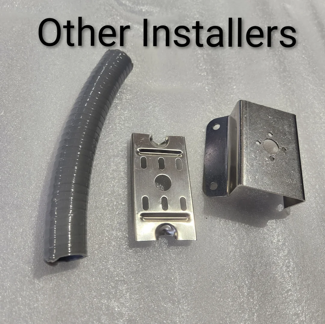 Other installers: off-the-shelf liquid-tight conduit, a stainless strap and a stamped metal bracket