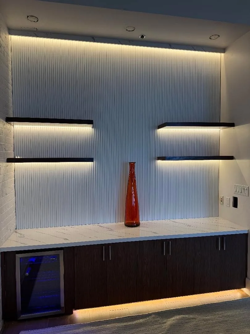 Media wall shelving lit from within
